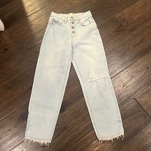 Light wash, blue vintage, straight jeans with four buttons.